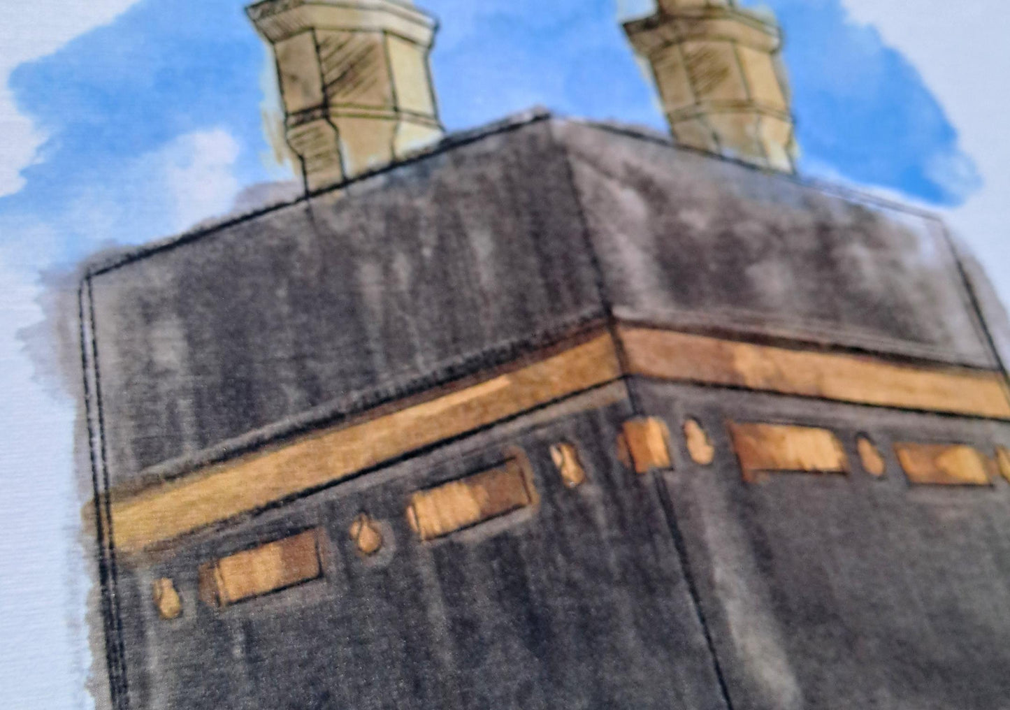 Kaaba digital watercolor print displayed in a modern living room interior, Islamic wall decor