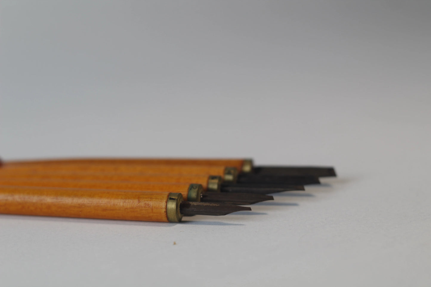 Side profile of Qalam Jawi pen on Arabic calligraphy paper