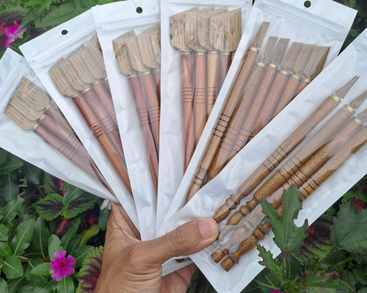 Dip calligraphy pen laying on parchment paper, ink visible