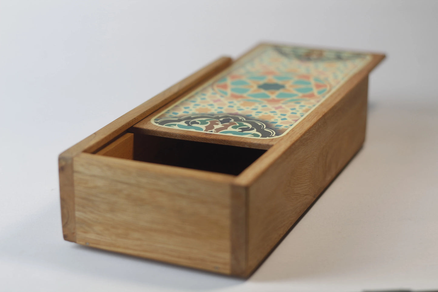 angled minimalist pen and ink storage box made of teak
