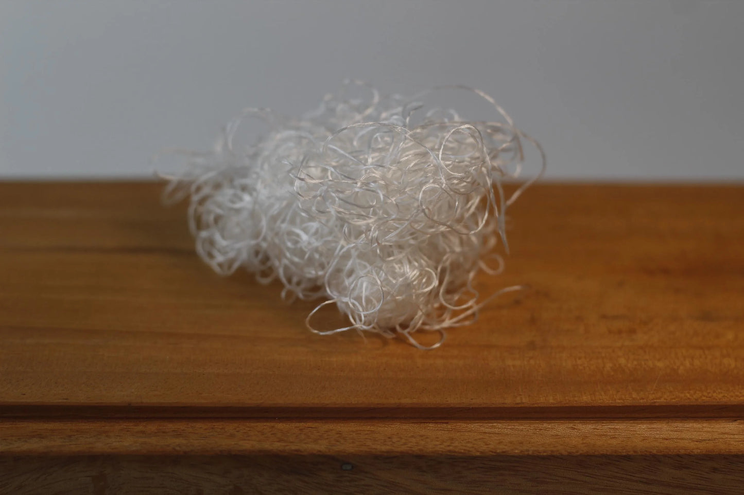 pure silk likka thread placed inside calligraphy inkwell