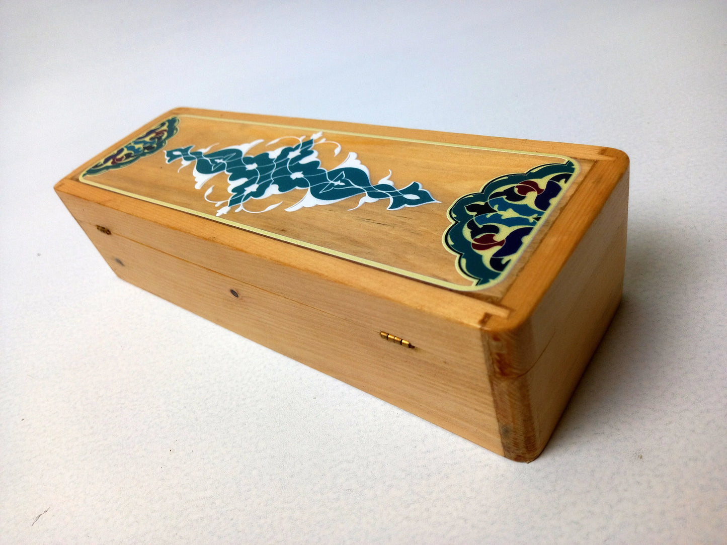 Top-open view of teak calligraphy box showing interior