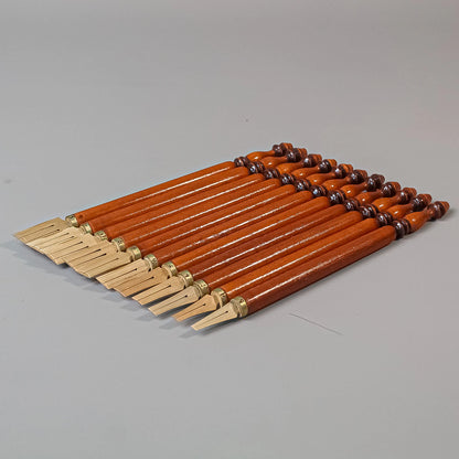 Detailed view of ink flow channels on bamboo reed qalam