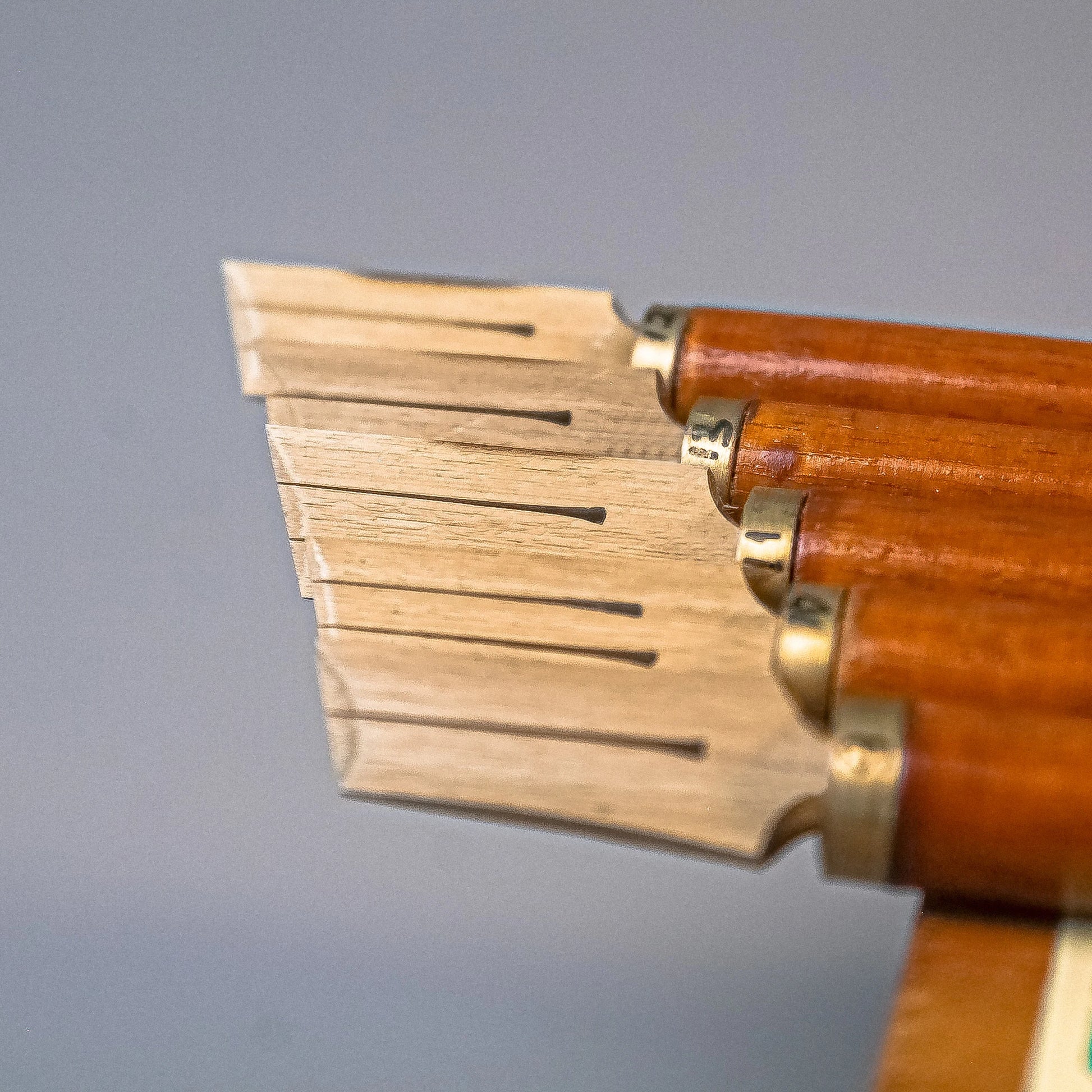 Wooden handle attached to bamboo qalam pen