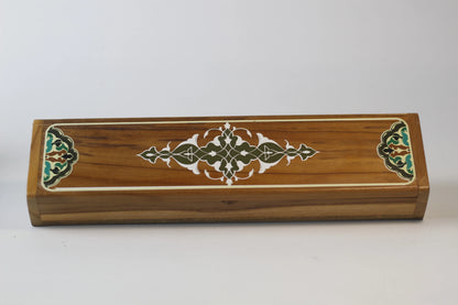 open interior view of teak calligraphy tool box with pens pencils ink