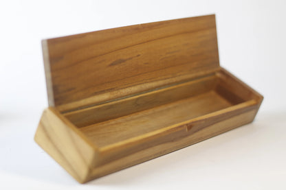 open box showing organized layout for pens brushes ink bottles